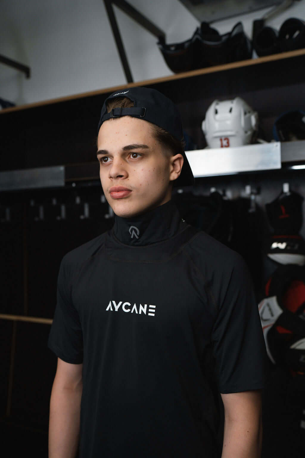 Young athlete wearing Aycane Blade X base layer short sleeve shirt, showcasing BNQcut-resistant neck protection.