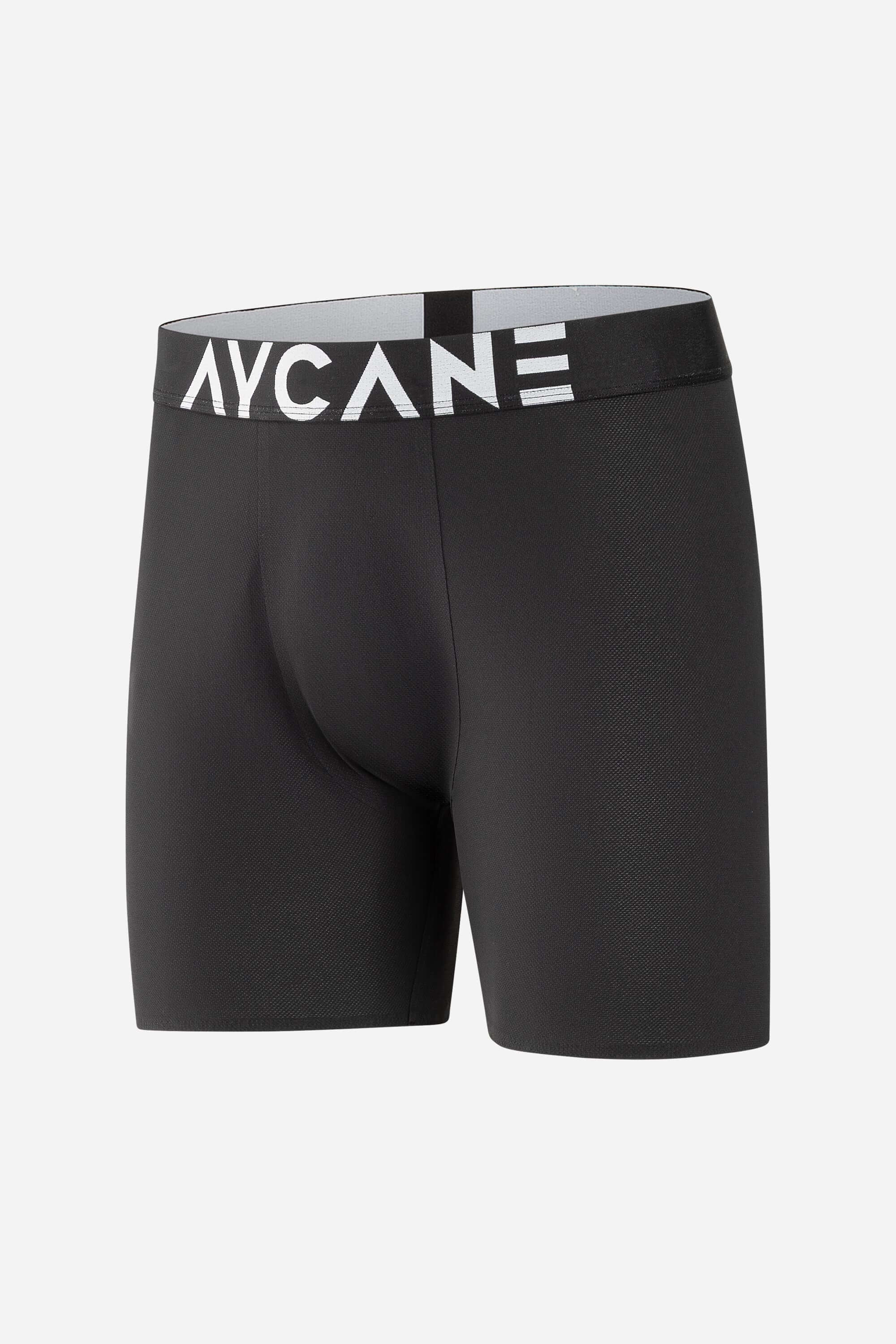 Black AYACANE boxer briefs with a comfortable waistband, designed for active wear and everyday comfort.