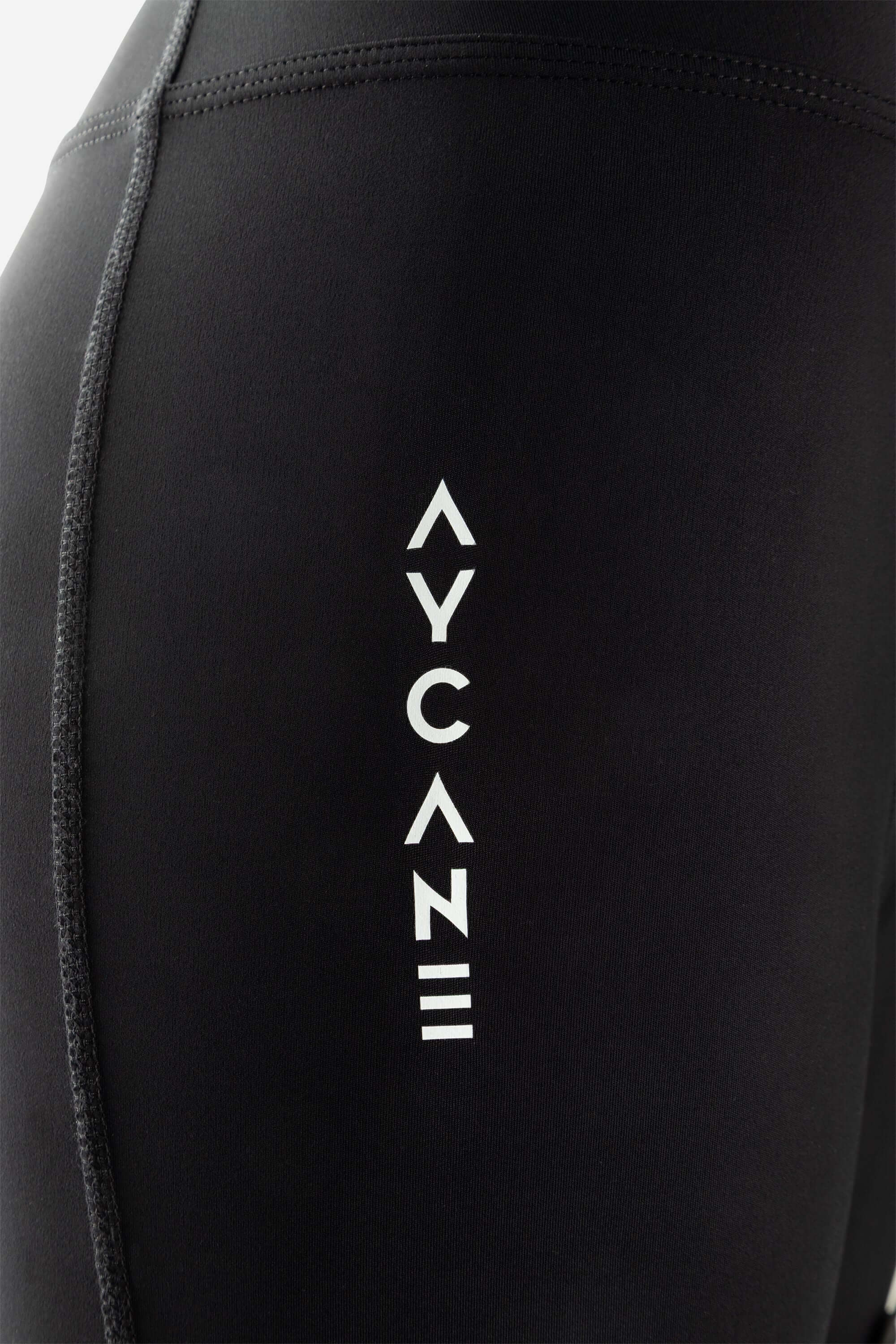 Black cut-resistant hockey pants close up picture with AYCANE logo