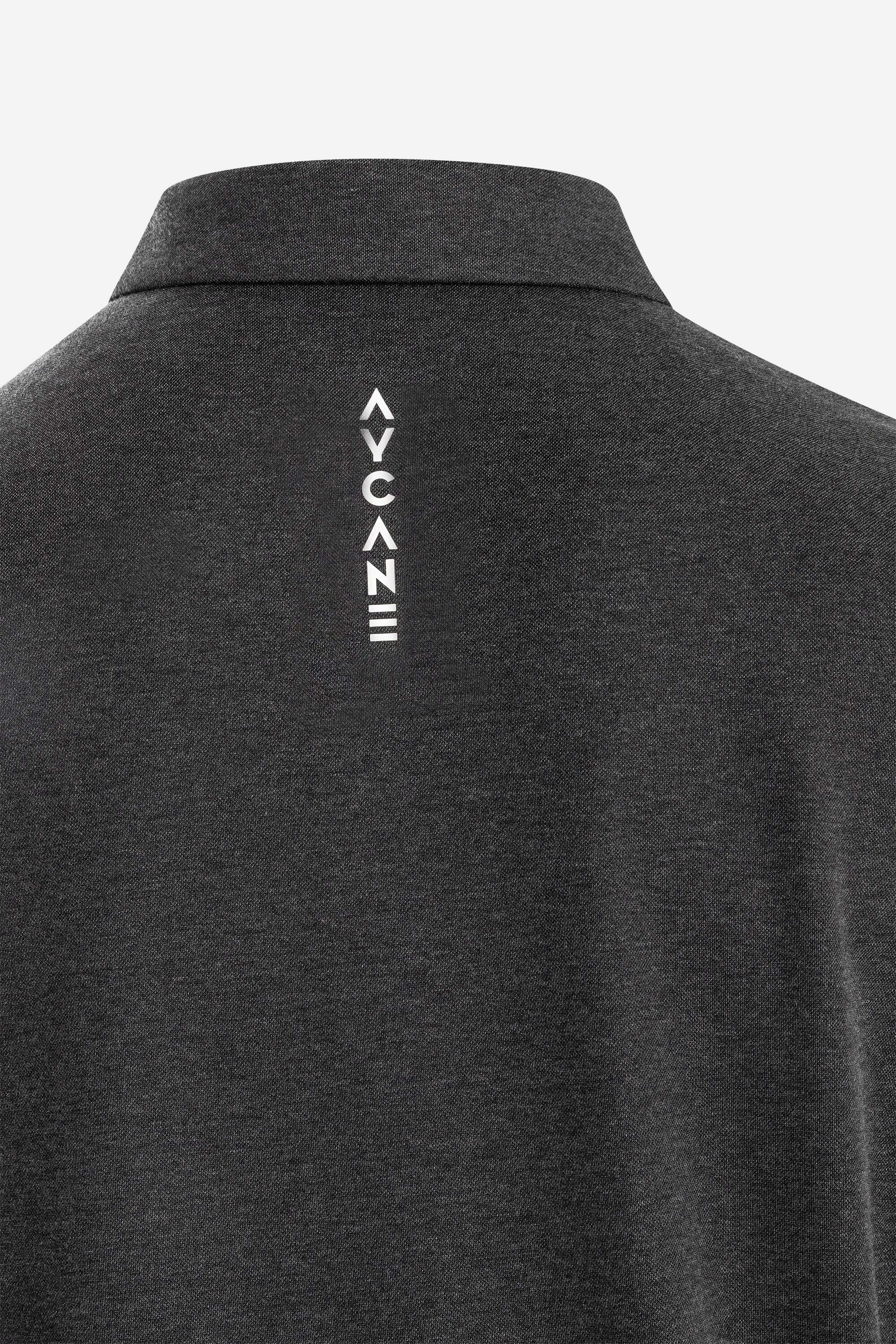 Back view of a dark gray polo shirt featuring a stylish logo design on the neck area.