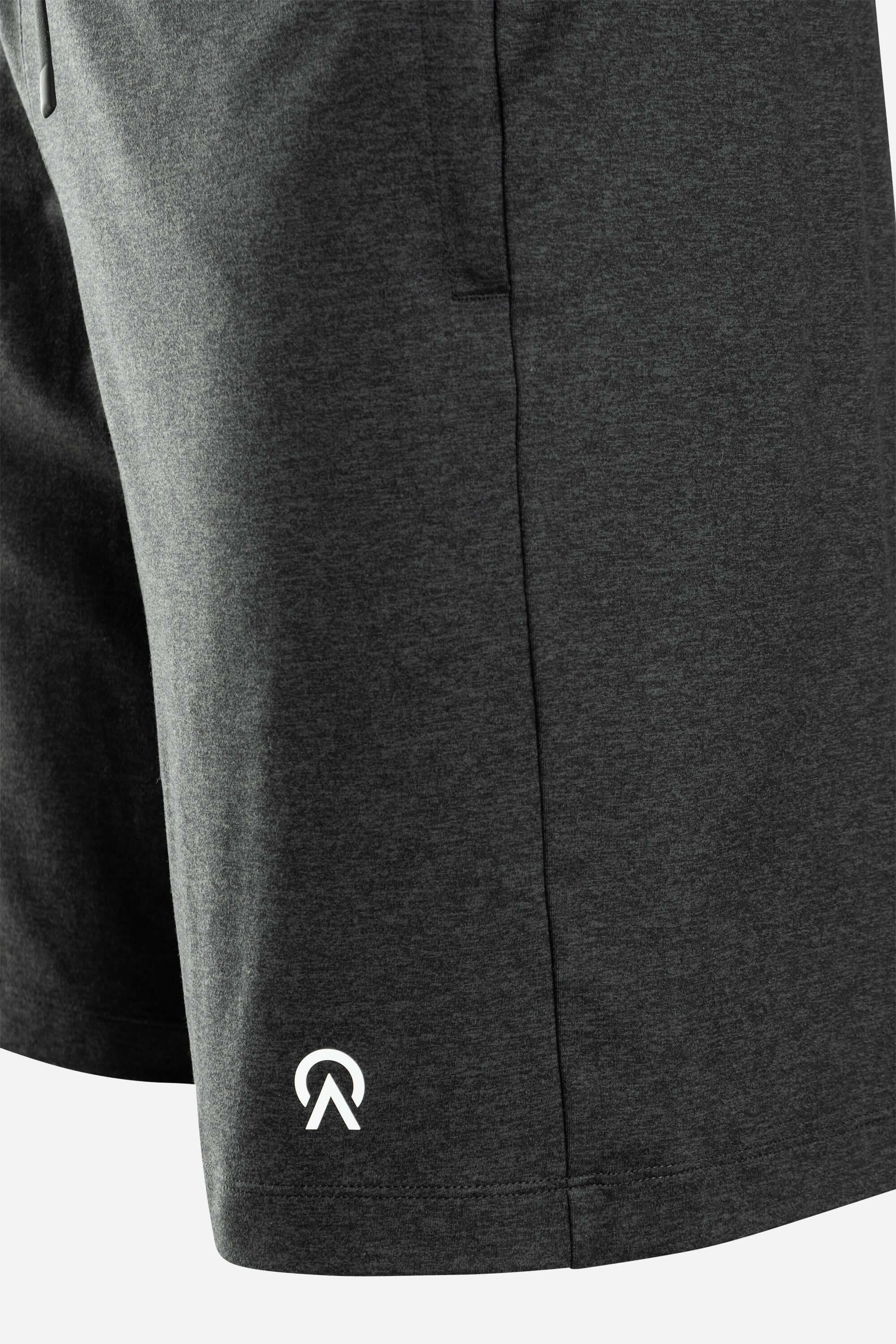 Close-up of Re.Force shorts in dark gray, featuring a sleek design and logo, ideal for style and comfort.