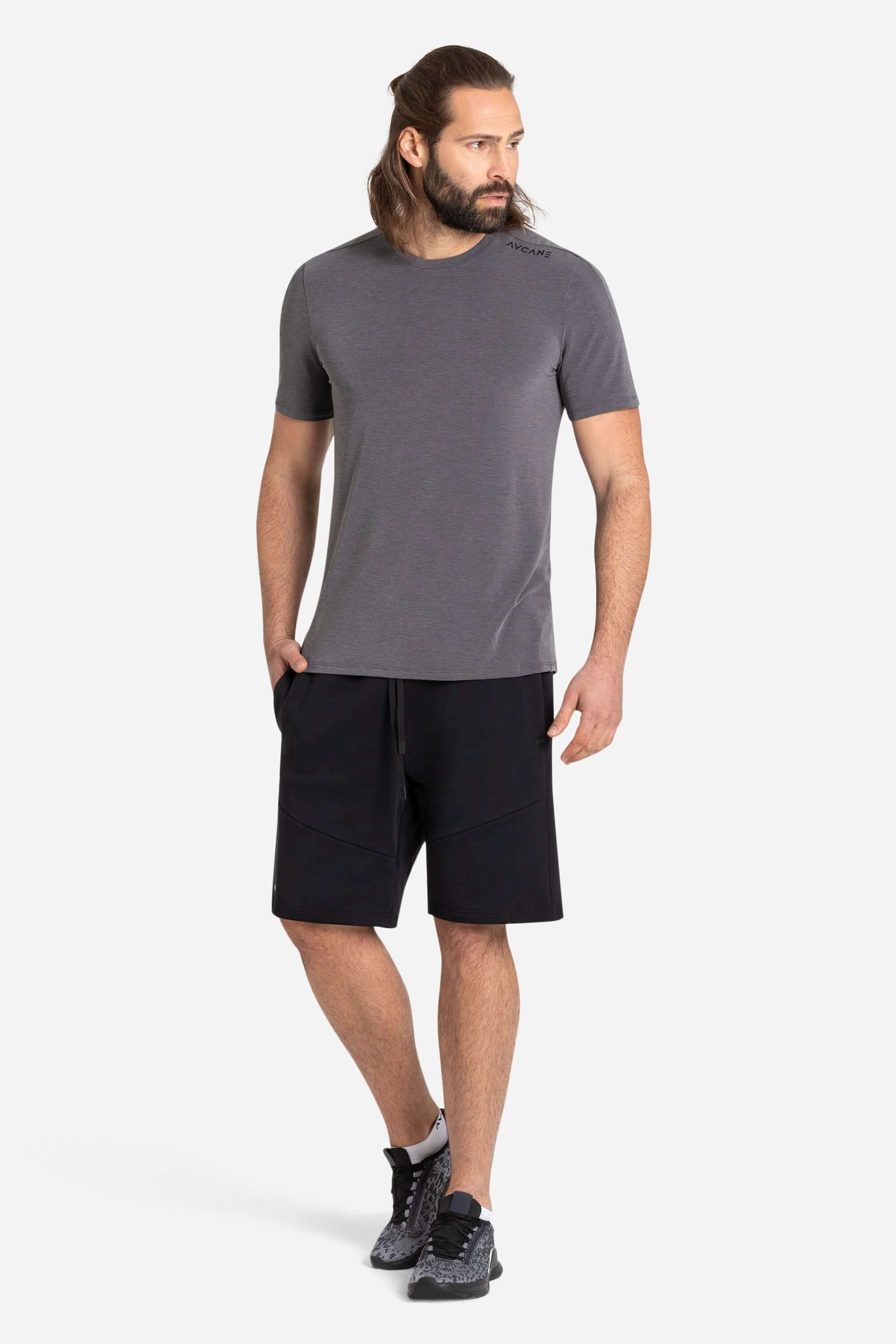 Men with a grey training t-shirt and black shorts from AYCANE