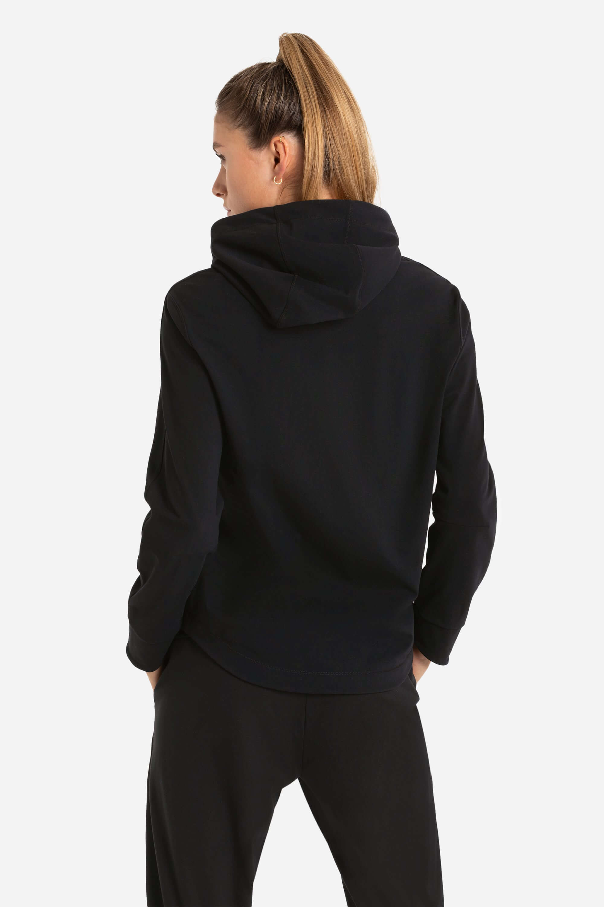 Women wearing a black training hoodie and gym jogger