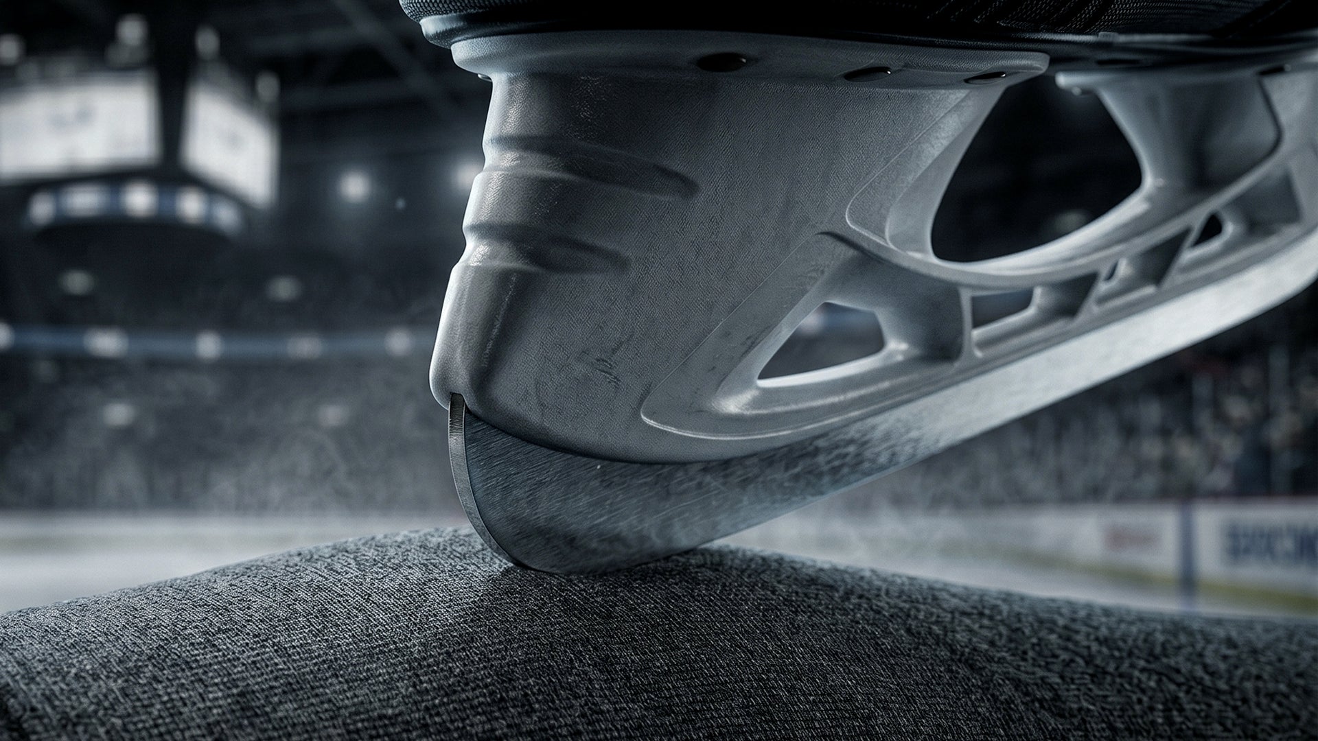 Youth competitive ice hockey players sitting shoulder to shoulder on the bench during an intense game, showing teamwork, focus, and shared struggle beyond winning.