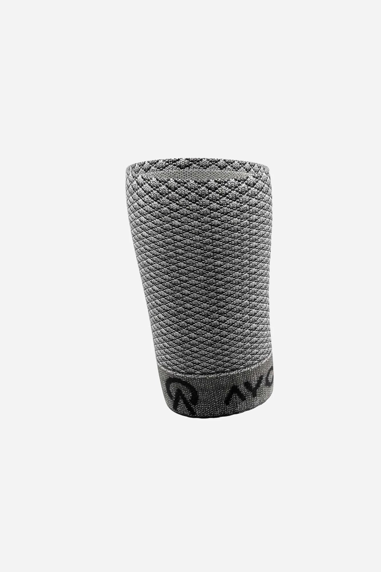 A-SHIELD wrist guard featuring a grey protective sleeve with woven texture and logo at the bottom.