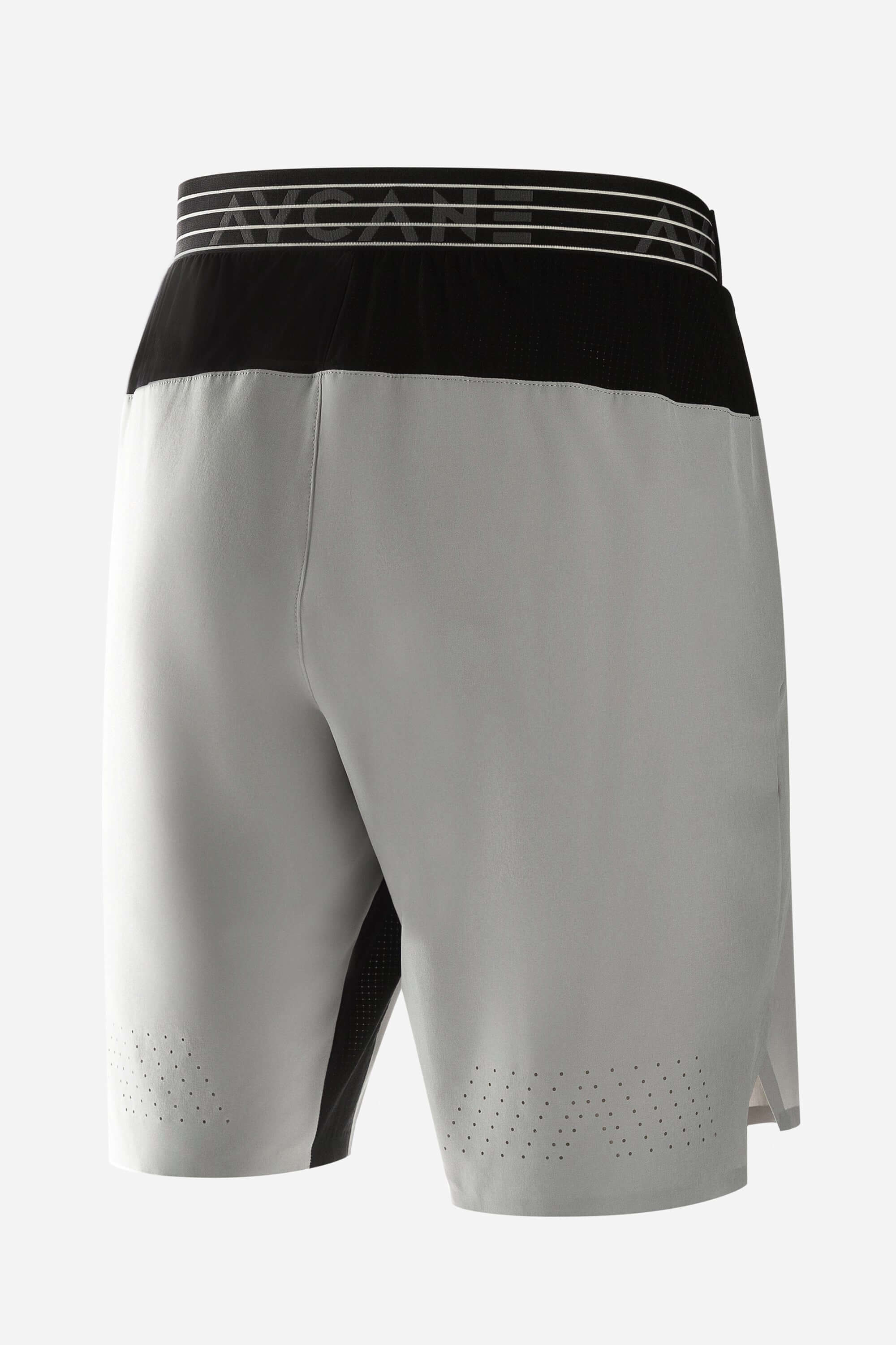 Grey workout shorts with side zips and laser cut holes