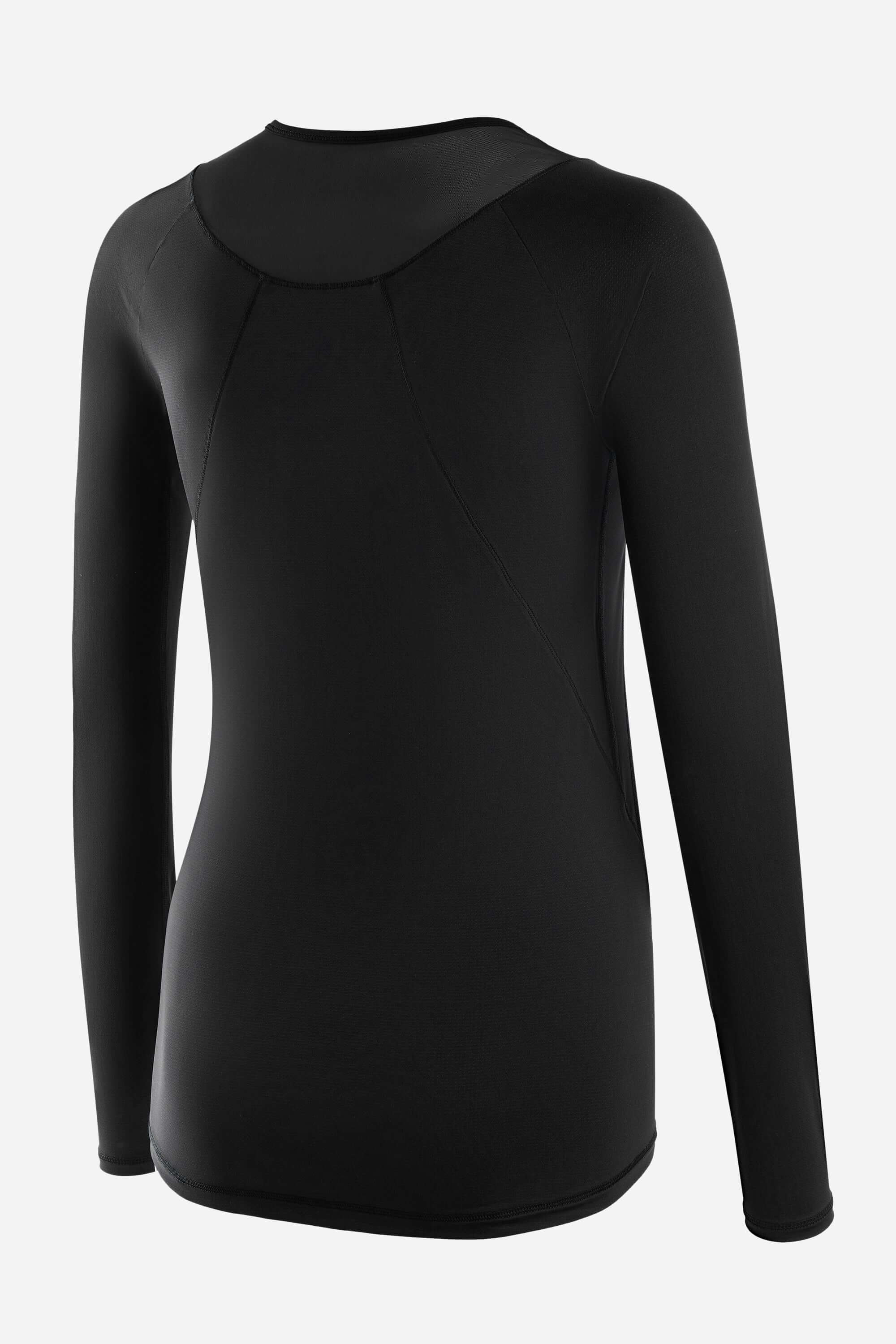 Women in a black long sleeve workout t-shirt with black short tights