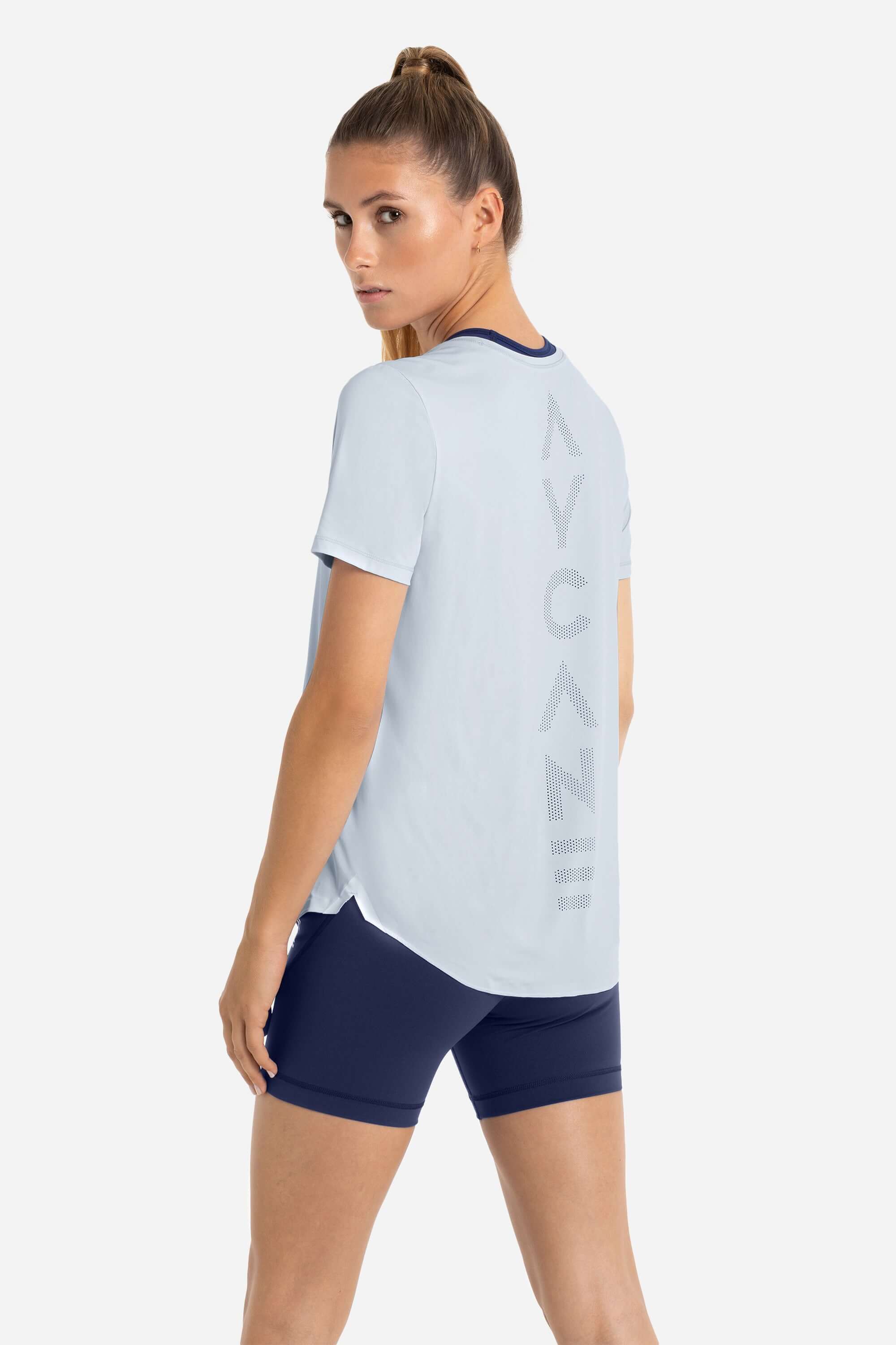 Women wearing a training t-shirt short sleeve in blue with short tights in blue from AYCANE