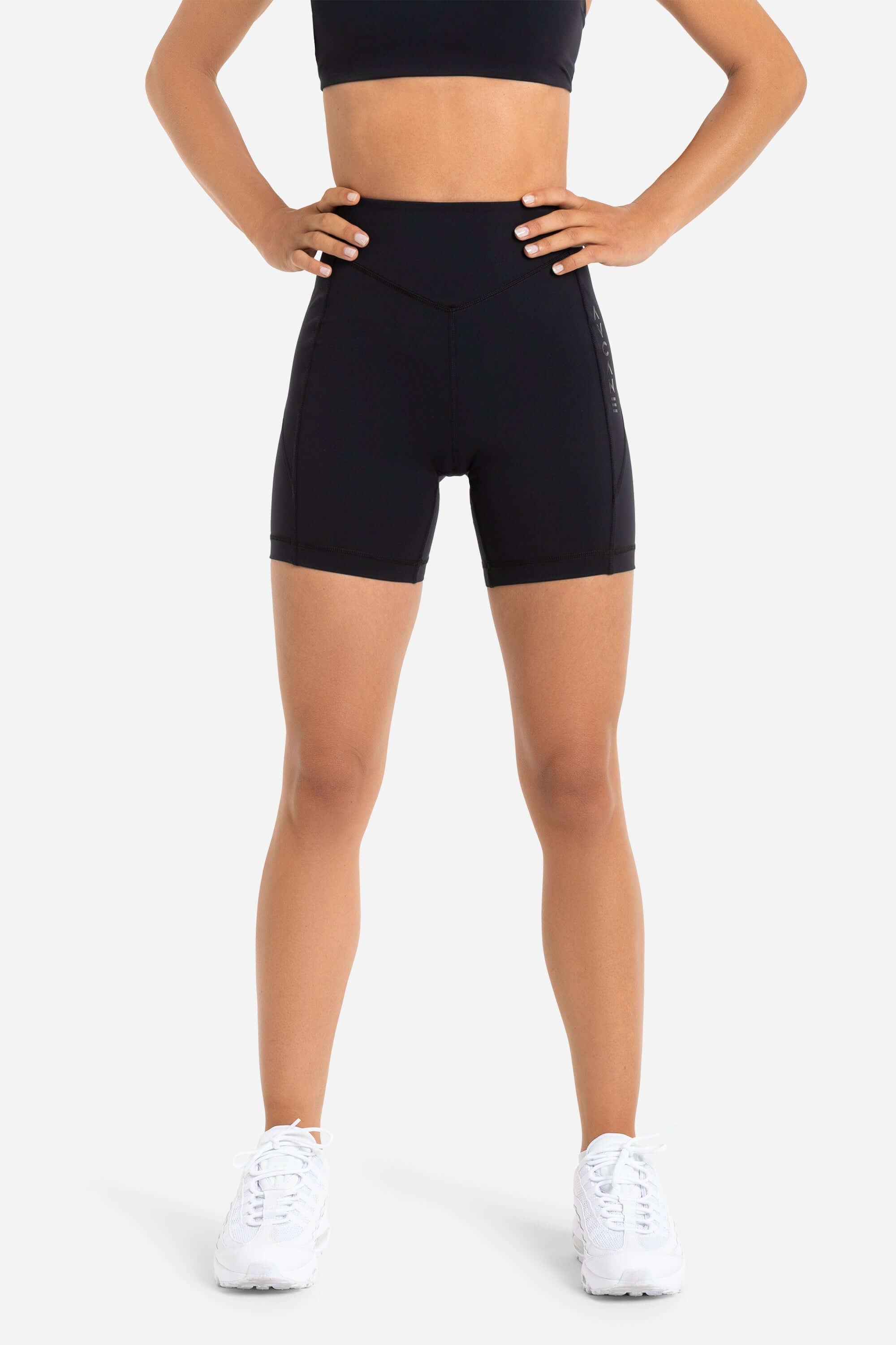 women in workout short tights in black