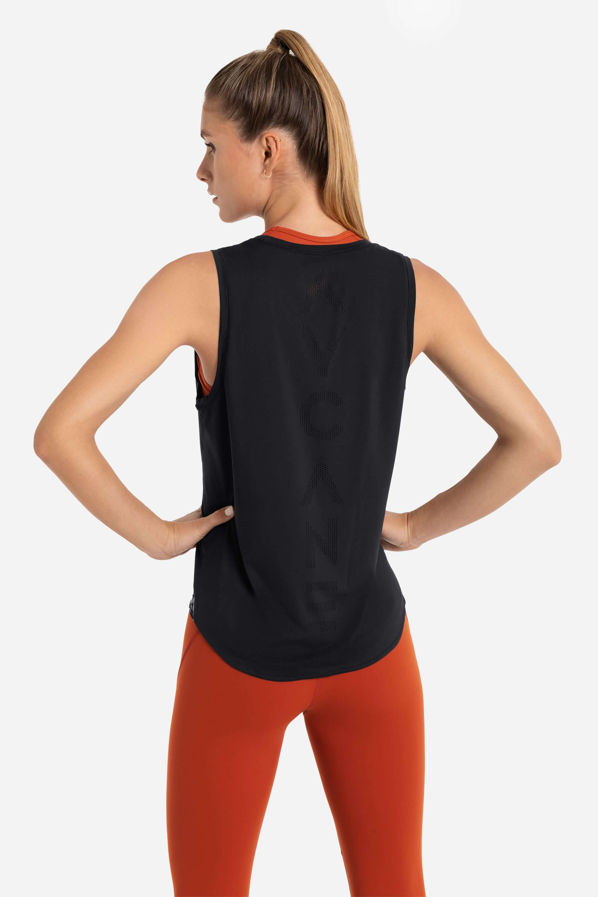 Women training tank top in black with laser cut holes in the back